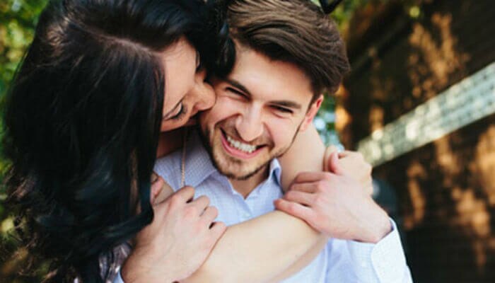 woman hugs guy